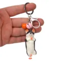 Kreativer Yoga Hund Schlüsselanhänger mit Glocke und Karabiner für Autoschlüssel und Taschen. - Einbeiniger Stand Husky / Orangerosa