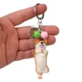 Schöner Yoga Corgi Schlüsselanhänger mit bunten Glocken und stabilem Metallring für Taschen. - Einbeiniger Yoga-Corgi / Grün und Rosa