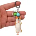 Yoga Corgi Schlüsselanhänger mit bunten Glöckchen niedlicher Tier Taschenanhänger Deko Accessoire - Einbeiniger Yoga-Corgi / Grün und Hellblau