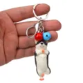 Yoga Hund Schlüsselanhänger süßer Husky Taschenanhänger mit Glocken und Karabinerring - Einbeiniger Stand Husky / Rot & Blau