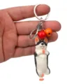 Süßer Yoga Hund Schlüsselanhänger mit bunten Glocken und Karabiner. Perfekte Autotasche Deko. - Einbeiniger Stand Husky / Rotorange