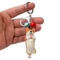 Süßer Yoga Corgi Schlüsselanhänger mit Glocken und Karabiner für Handtasche und Autoschlüssel. - Einbeiniger Yoga-Corgi / Rot und Hellblau