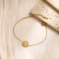 Gold stainless steel flower bracelet detail view, delicate clover charm jewelry close up display. - Single Five-Leaf Bracelet / Gold