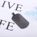 Close up of black stainless steel dog tag pendant, minimalist design, smooth texture detail. - Pendant Only (Without Chain) / Black