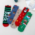 Detailed view of cute Christmas cotton crew socks with magnetic hands holding design. - Multicolor