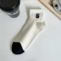 Women white short cotton socks with black toe and number 5 embroidery, breathable variant. - Number 5