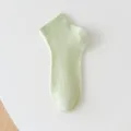 Detailed shot of light green mesh ankle socks, breathable summer thin cotton socks. - One Size / Green