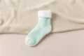 Close-up detail of mint green thickened plush winter thermal sock with cozy inner lining. - One Size / Light Colors - Lake Green