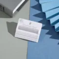 Detailed view of white earring cards with multi-hole paper packaging for jewelry display studs - 5.5x3cm 6 Holes