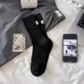Solid color mid-calf socks for women, vintage ribbed cotton socks with stylish tag. - Black