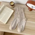 Cozy argyle slouch socks in soft cotton, featuring a chic retro floral pattern for daily wear. - One Size / Beige