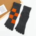 Men's cotton five-toe socks, dark grey with vibrant orange checkered pattern, mid-calf. - One Size / Orange Plaid