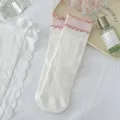 Japanese style white cotton mid-tube socks with pink ruffled lettuce edge for women. - One Size / White
