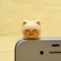 Cute cat dust plug for smartphone, adorable kitty design accessory for mobile phone protection. - Yellow