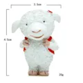 Detailed view of cute resin sheep figurine with red backpack for miniature garden decor. - Sheep Sister
