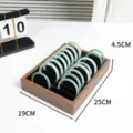 Walnut multi-grid bangle storage display tray set with green jade bracelets for showcase. - Walnut Color 20 Slots Bangle Tray / Inner Black