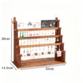 Hölzerner Ohrring-Ständer mehrstufiger Schmuck-Organizer für Ohrringe und Stecker im Laden. - Walnussfarbe 5-lagiger horizontaler Balken