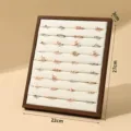 Wooden ring display stand with beige velvet slots, vertical jewelry organizer for retail. - Row Ring Display Organizer