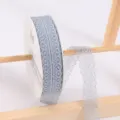 Light blue lace ribbon roll for gift wrapping and floral bouquet decoration crafting supplies. - Light Gray