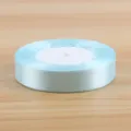Light blue satin ribbon spool for gift wrapping, flower bouquet packaging and craft decorating. - Light Blue