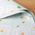 Light blue floral wrapping paper with white abstract flowers and green leaves for bouquet. - Clear Sky Blue