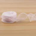 Pink organza ribbon with pearl edge, ideal for gift wrapping, floral bouquets, and DIY crafts. - Pink