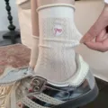 Women cute mesh mid-calf socks with sweet pink bow embroidery and classic diamond pattern. - White