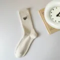 Comfortable men's cotton crew socks featuring chic embroidered letter design for daily wear. - One Size / Off White