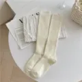 Calze alte a coste tinta unita in misto cashmere, calzettoni lunghi invernali caldi da donna. - Crema