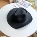 Classic black straw sun hat with wide brim, perfect for outdoor beach and summer vacation. - Black