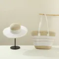 Detailed shot of summer straw hat and woven handbag set with beige and white stripes. - Set / Beige