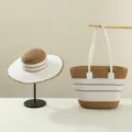 Detail shot of a stylish straw hat and matching striped handbag set, perfect for summer. - Set / Khaki