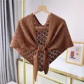 Detailed view of women brown hollow-out knitted shawl draped triangular scarf for office wear. - Coffee
