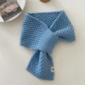 Detail view of the cozy blue knitted winter neck scarf, soft cross-design warm student neckerchief. - Perforated Ear Scarf - Blue