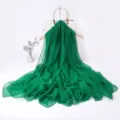 Green chiffon long scarf detail view, elegant draping, perfect spring fashion accessory. - Dark Green