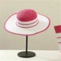 Detailed view of the pink and white striped straw sun hat, perfect for outdoor travel. - Hat Only / Rose Red