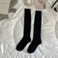 Black ribbed high tube socks for women, solid color autumn and winter knee high fashion. - Calf-High Black