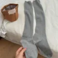 Calze lunghe in maglia grigia da donna, comode scaldamuscoli invernali termici in tinta unita. - Taglia unica / Grigio chiaro