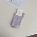 Light purple ribbed women's mid-tube socks made of comfortable cotton for daily wear. - One Size / Light Purple
