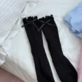 Cute black mid-calf socks for women featuring sweet ruffles and dainty bow accents for daily wear. - One Size / Black