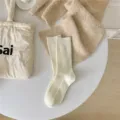 Calze a coste a metà gamba in cashmere tinta unita, stile vintage giapponese autunno inverno. - Crema