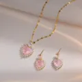 Detailed view of elegant pink heart cubic zirconia gold necklace and sparkling earrings. - Set / Pink Heart Set