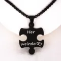 Close-up detail of black stainless steel puzzle pendant necklace with romantic text engraving. - Her Weirdo Black