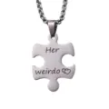 Close-up detail shot of a stainless steel puzzle piece pendant necklace engraved with sweet text. - Her Weirdo Silver