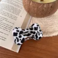Small bone shaped hair claw clip black and white cow print aesthetic hair accessory for women. - Milk Cow Pattern