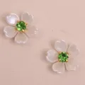 Detail shot of DIY five petal flower patch with white pearl petals and green rhinestone center. - Green