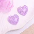 Close up of purple glitter heart resin cabochons for DIY hair accessories and crafts. - Sequin Heart