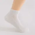 Comfortable breathable women's solid color sports mesh short socks with towel bottom detail. - One Size / White