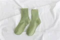 Green ribbed crew socks detail shot, simple and comfortable everyday cotton sock texture. - Size 35-40 / Avocado Green