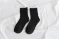 Close-up detail shot of classic black crew socks on white background, daily wear. - Size 35-40 / Black